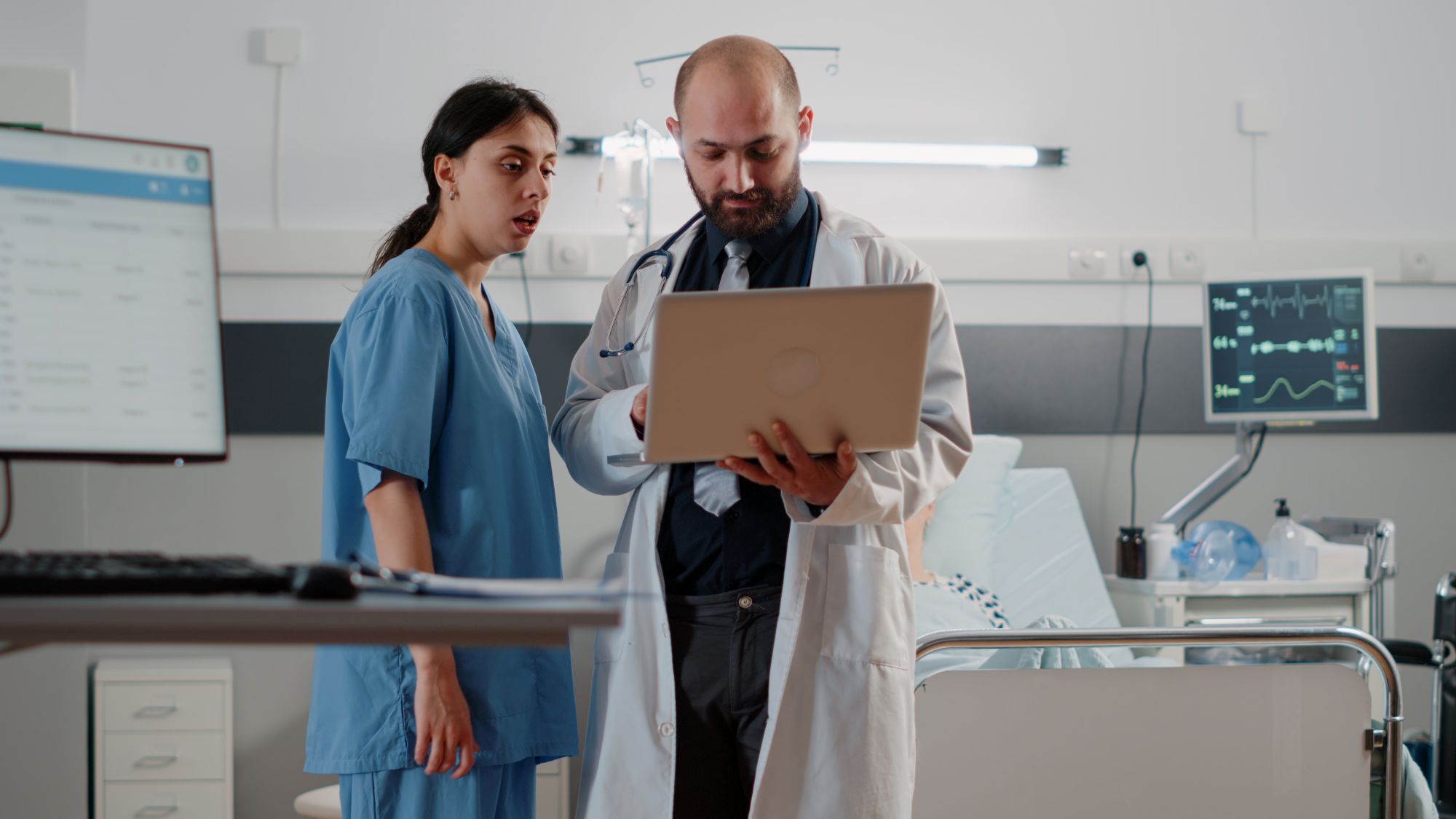professional analyzing overcomplicated healthcare technology infrastructure in hospital