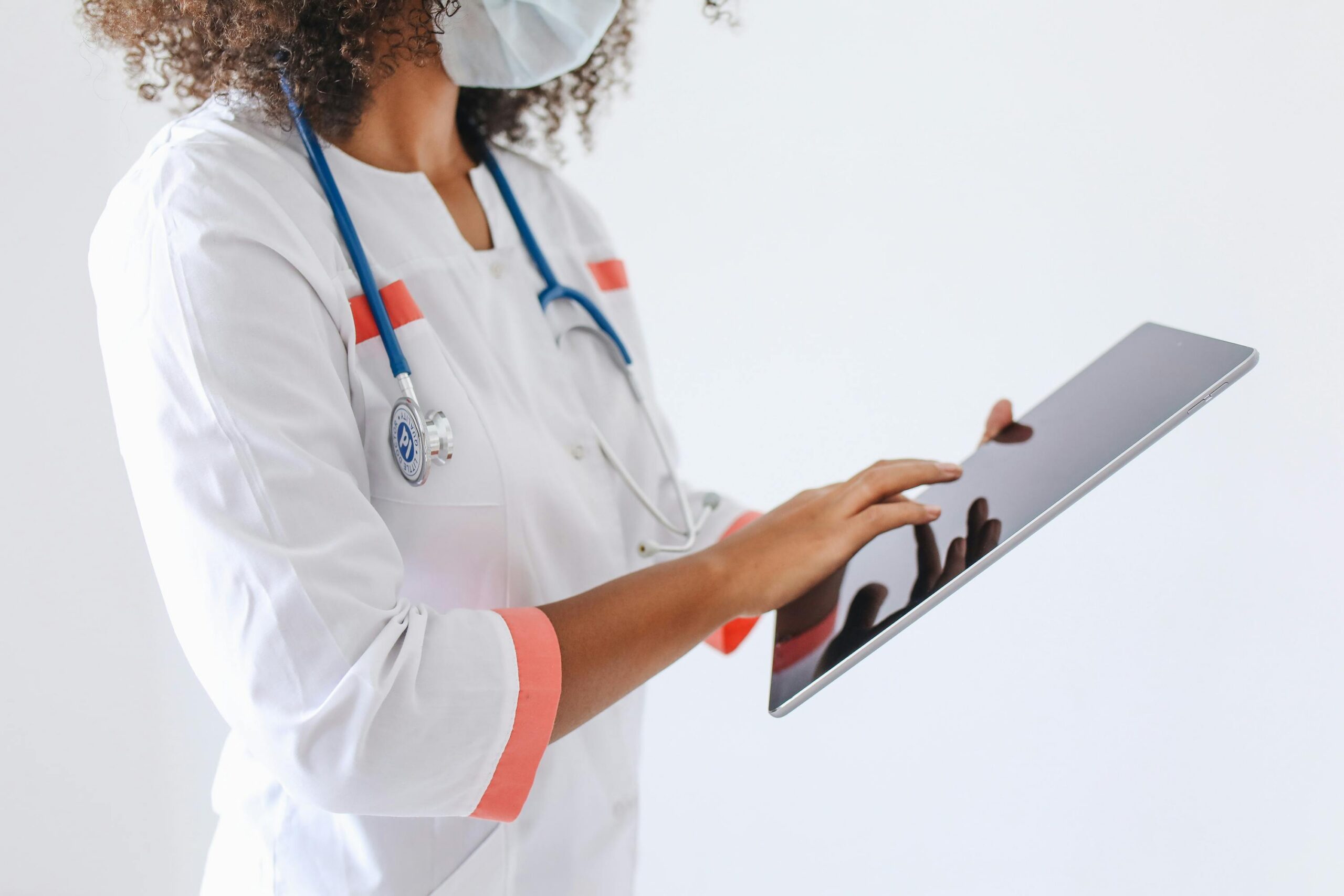 Healthcare professional using mobile device to support clinical mobility and patient care workflows
